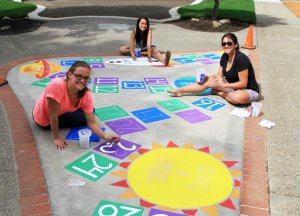 Youth Action Council crew are excited to unveil their custom made hopscotch game at George Rogers Park's playground Grand Opening this Saturday. 
